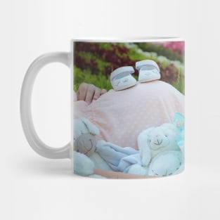 pregnant woman in the park surrounded by stuffed toys Mug